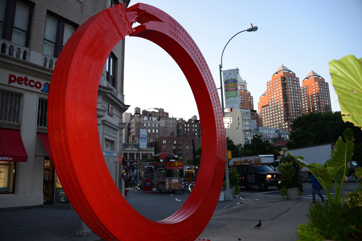 07-3 Vivid Red Steel Sculpture By Alexandre Arrechea Reimagines The Sherry Netherland Hotel as an Ouroboros In Union Square Park New York City